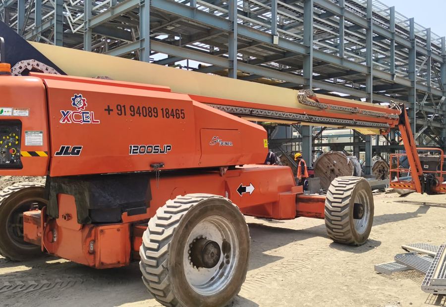 JLG 1200SJP telescopic boom lift with 120 foot reach at an industrial steel structure site