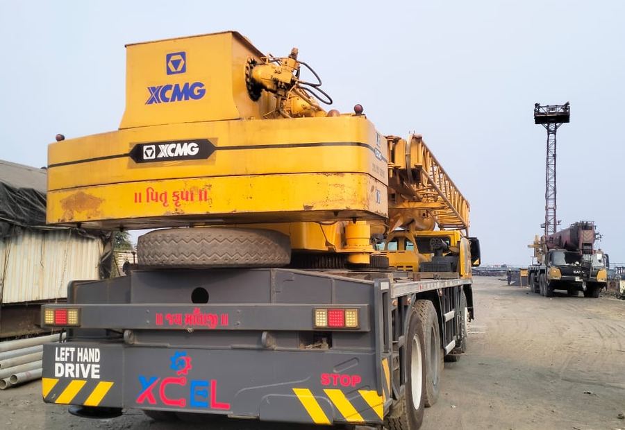 XCMG 70 tonne telescopic crane rear view showing outriggers and boom stowed for transport